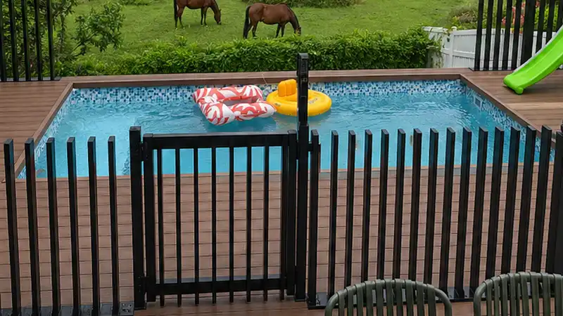 black powder coated aluminum blade fence installed on concrete in Australia