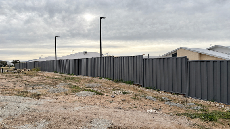 Colorbond-style fence project showing slope, gate and plinth factors that affect fencing cost