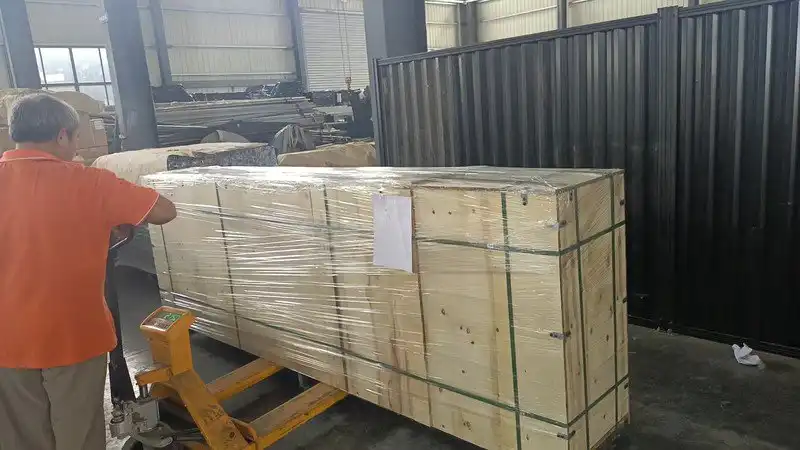 Bulk colorbond-style fence panels inspected for colour consistency before shipment