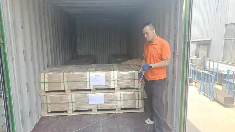 Packaged colorbond-style steel fence panels with edge protection for export shipping