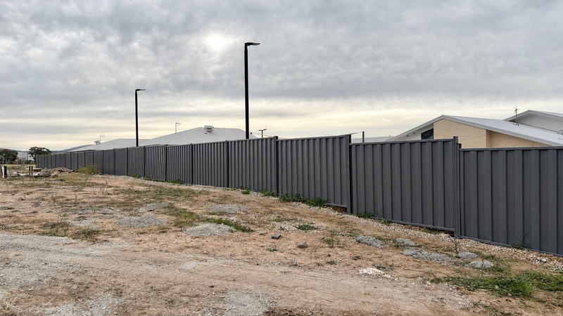 Australian residential boundary fencing project using low-maintenance metal fence panels for long-term project value