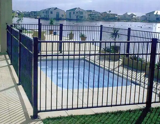 Black tubular fencing installed along a residential property boundary